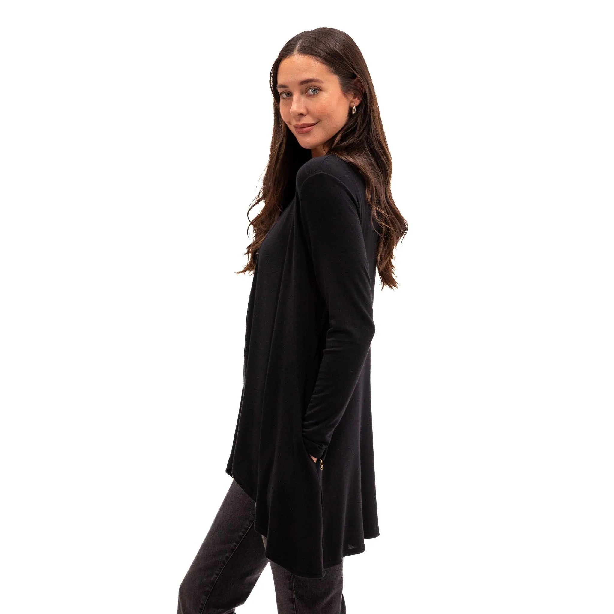 Woman wearing black long-sleeve travel wrap for flights and everyday comfort