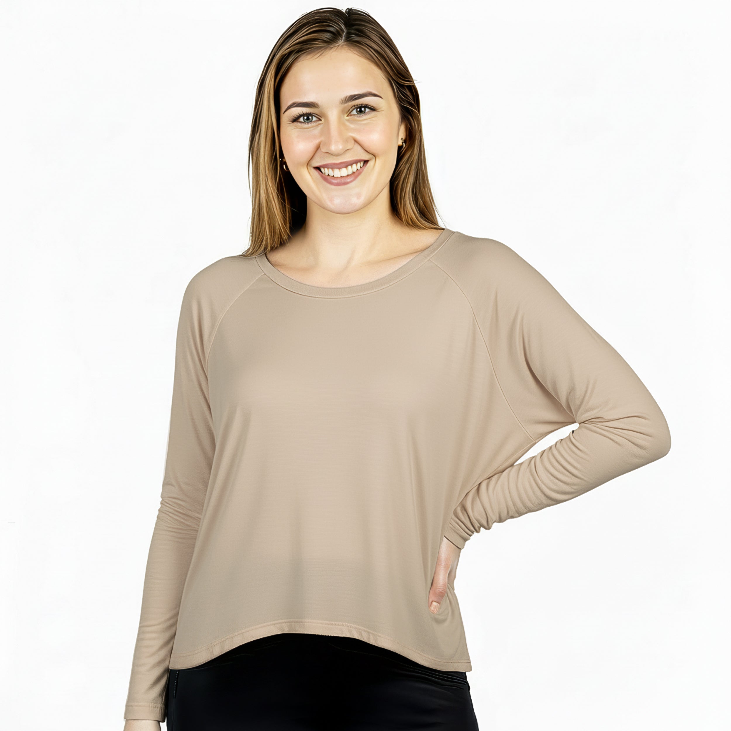 Woman wearing soft beige long sleeve travel top, ideal for flights and everyday comfort