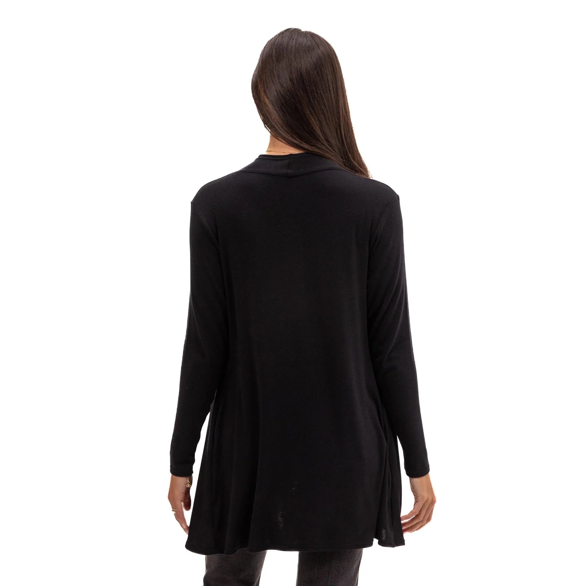 Black long-sleeve travel tunic top for women, soft sustainable fabric, ideal for flights and everyday wear