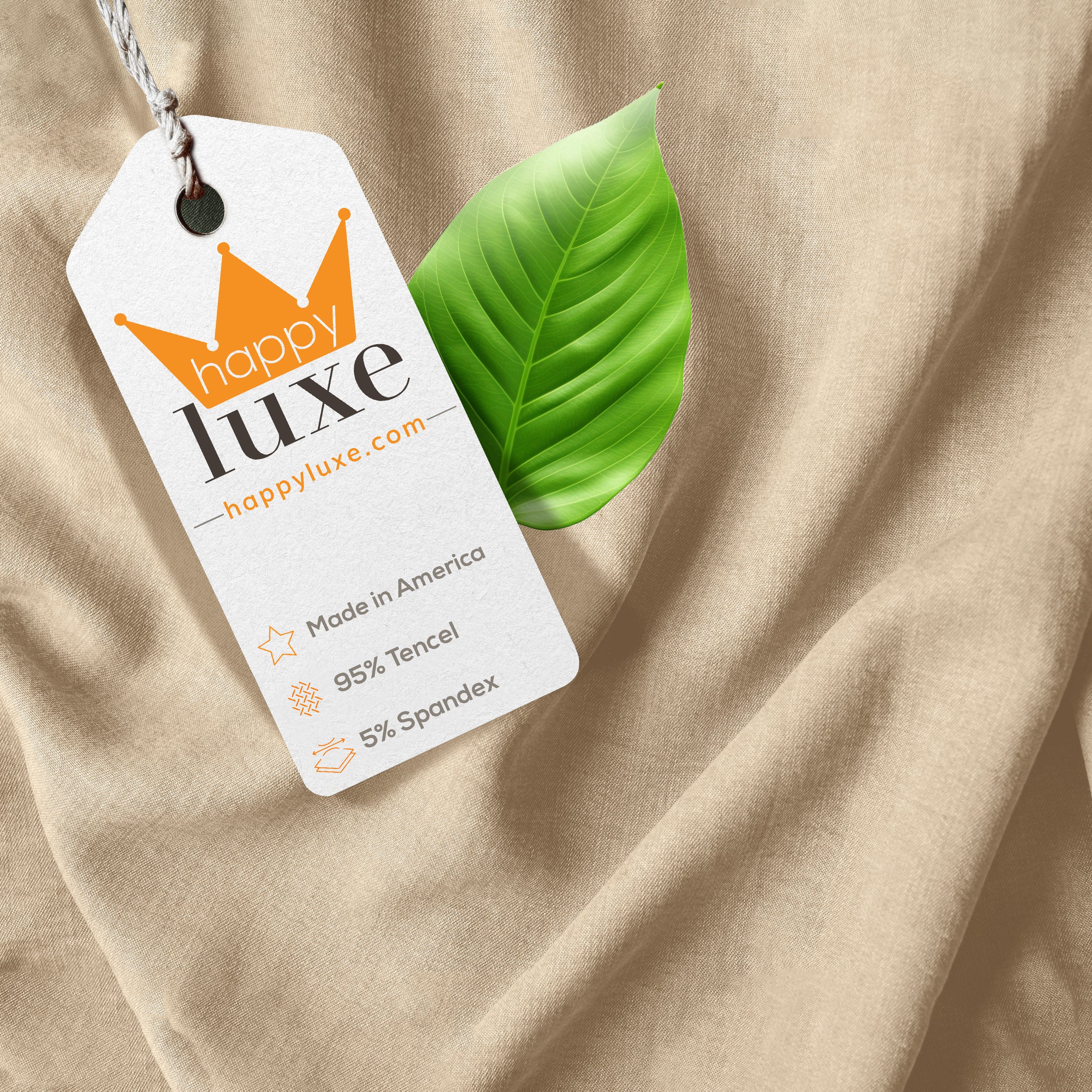 Happy Luxe tag on soft sustainable fabric with green leaf, 95% Tencel, Made in America