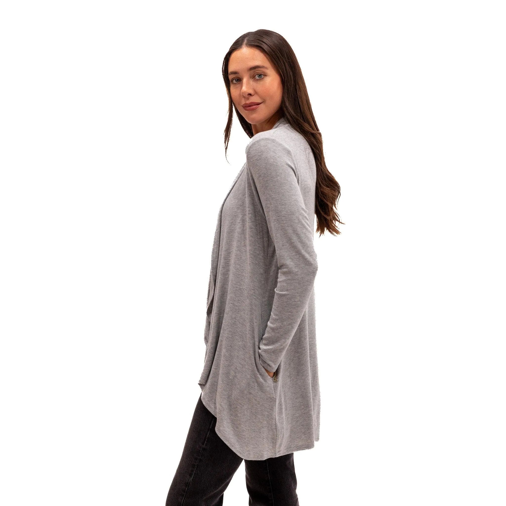 Woman wearing cozy gray long-sleeve travel cardigan with pockets, ideal for flights and everyday comfort.