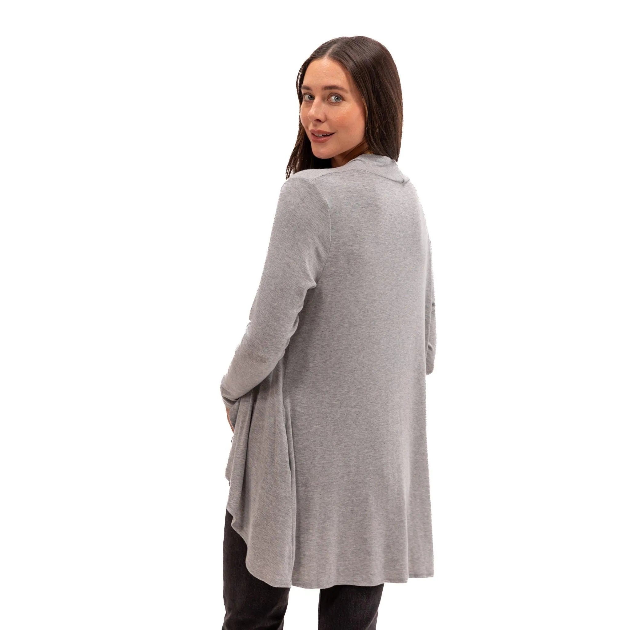 Woman wearing soft gray long-sleeve travel tunic for comfortable flights and everyday wear