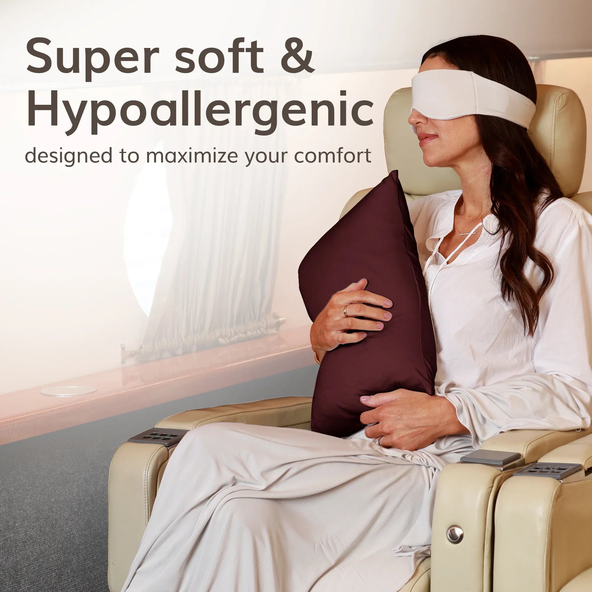 Woman relaxing with soft hypoallergenic travel pillow and eye mask on luxury seat