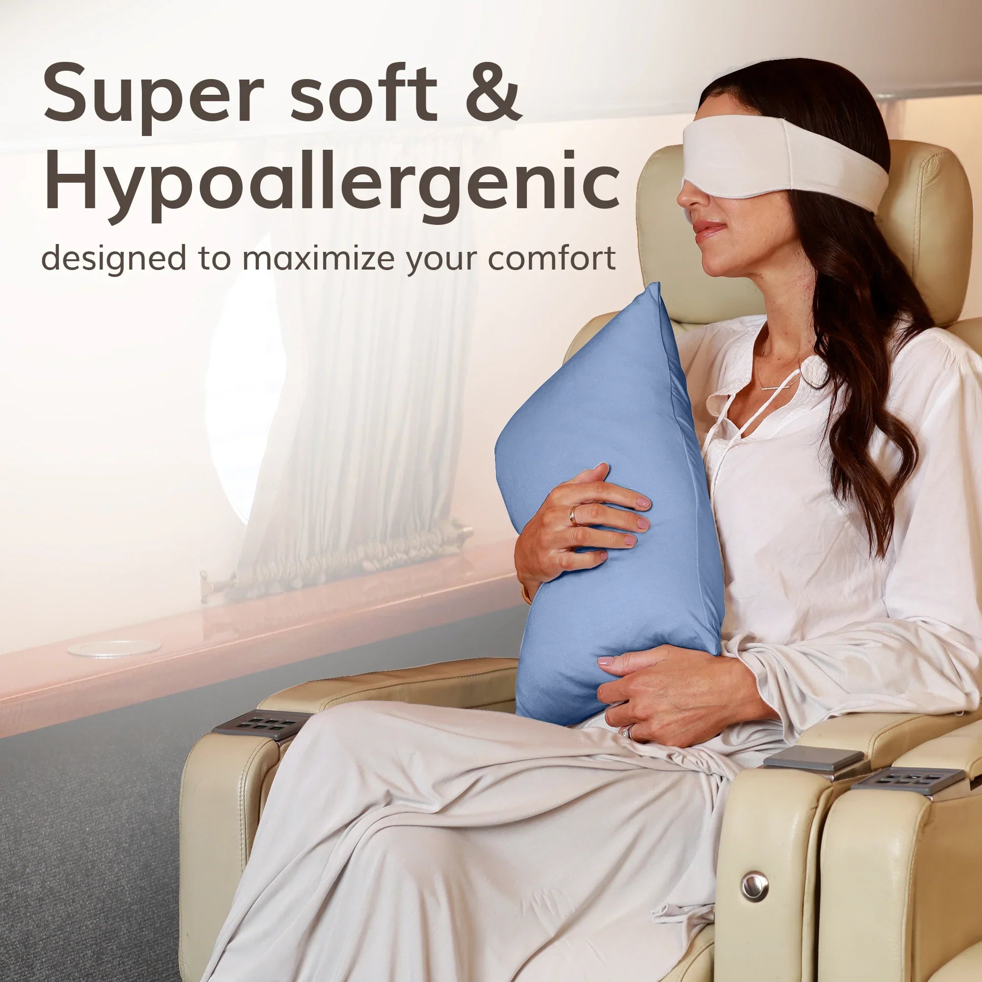 Woman relaxing with soft hypoallergenic travel pillow and sleep mask on luxury seat