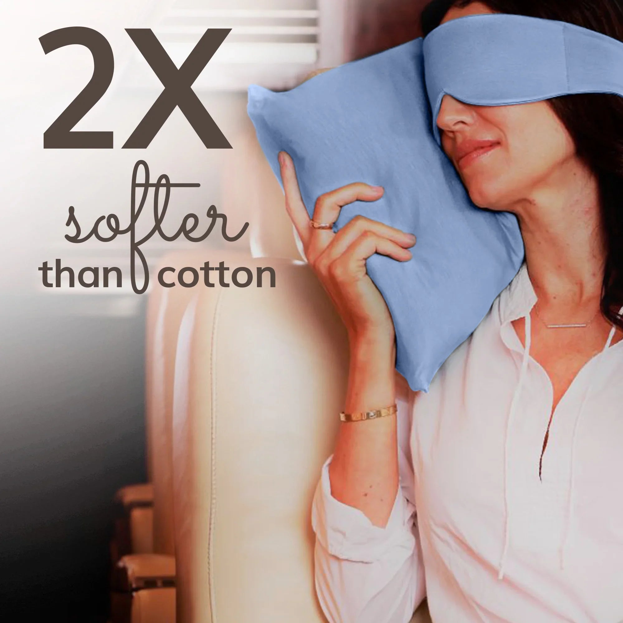 Woman sleeping with soft blue travel pillow and eye mask, 2X softer than cotton for luxury comfort