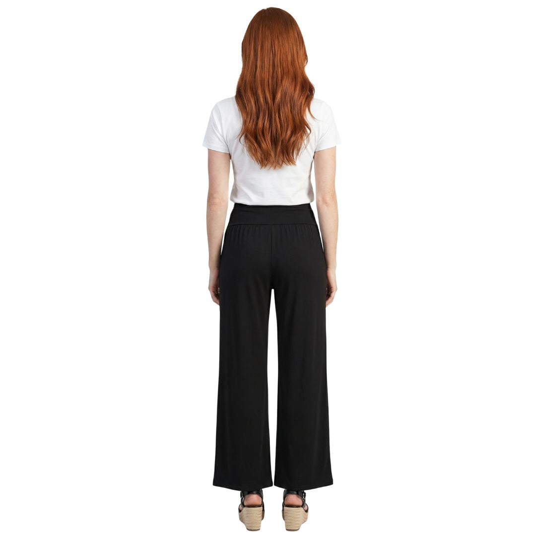 Black wide-leg pants with elastic waist, shown from back on model with white tee and espadrille wedges