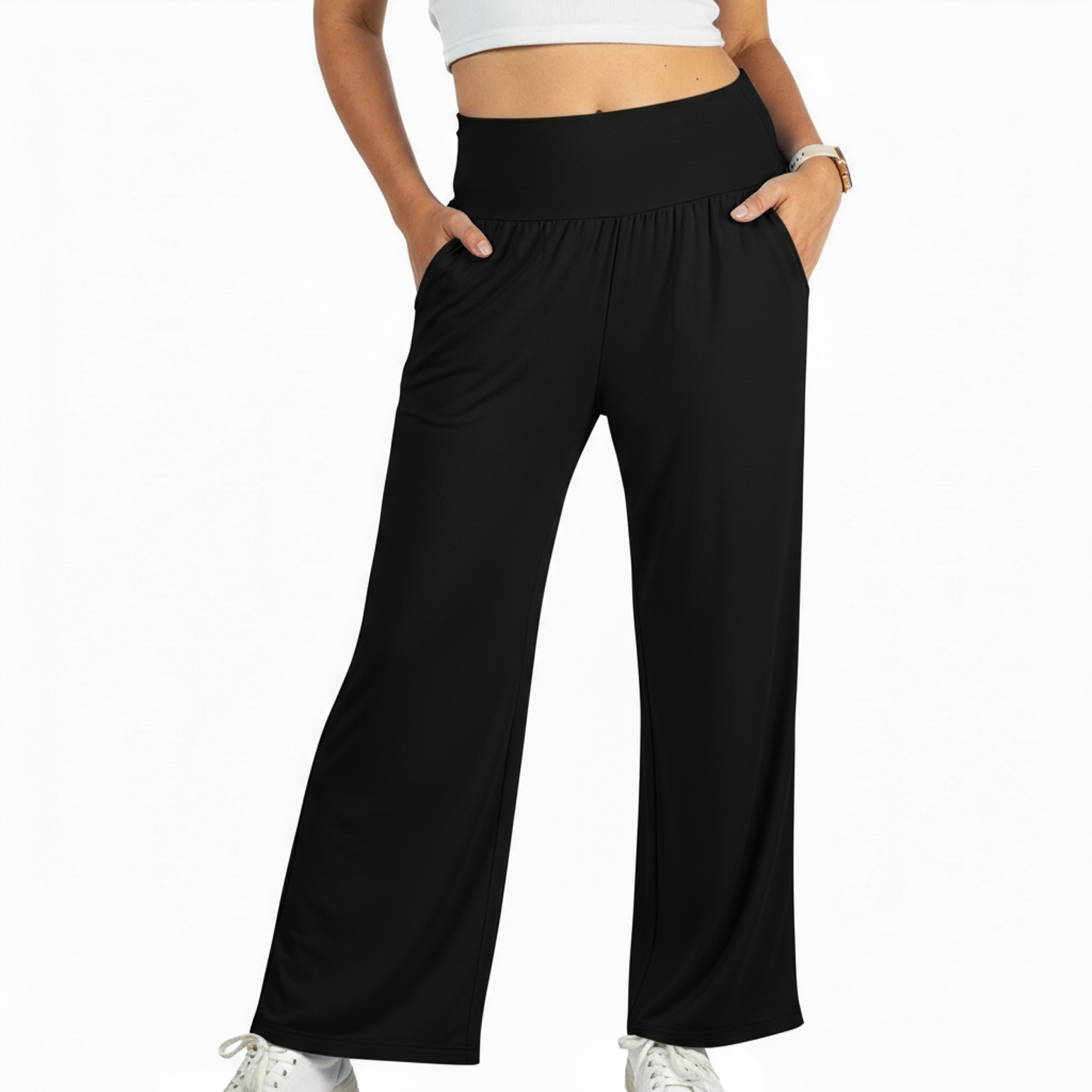 Black wide-leg travel pants with elastic waistband and side pockets, ideal for comfort on flights or at home.