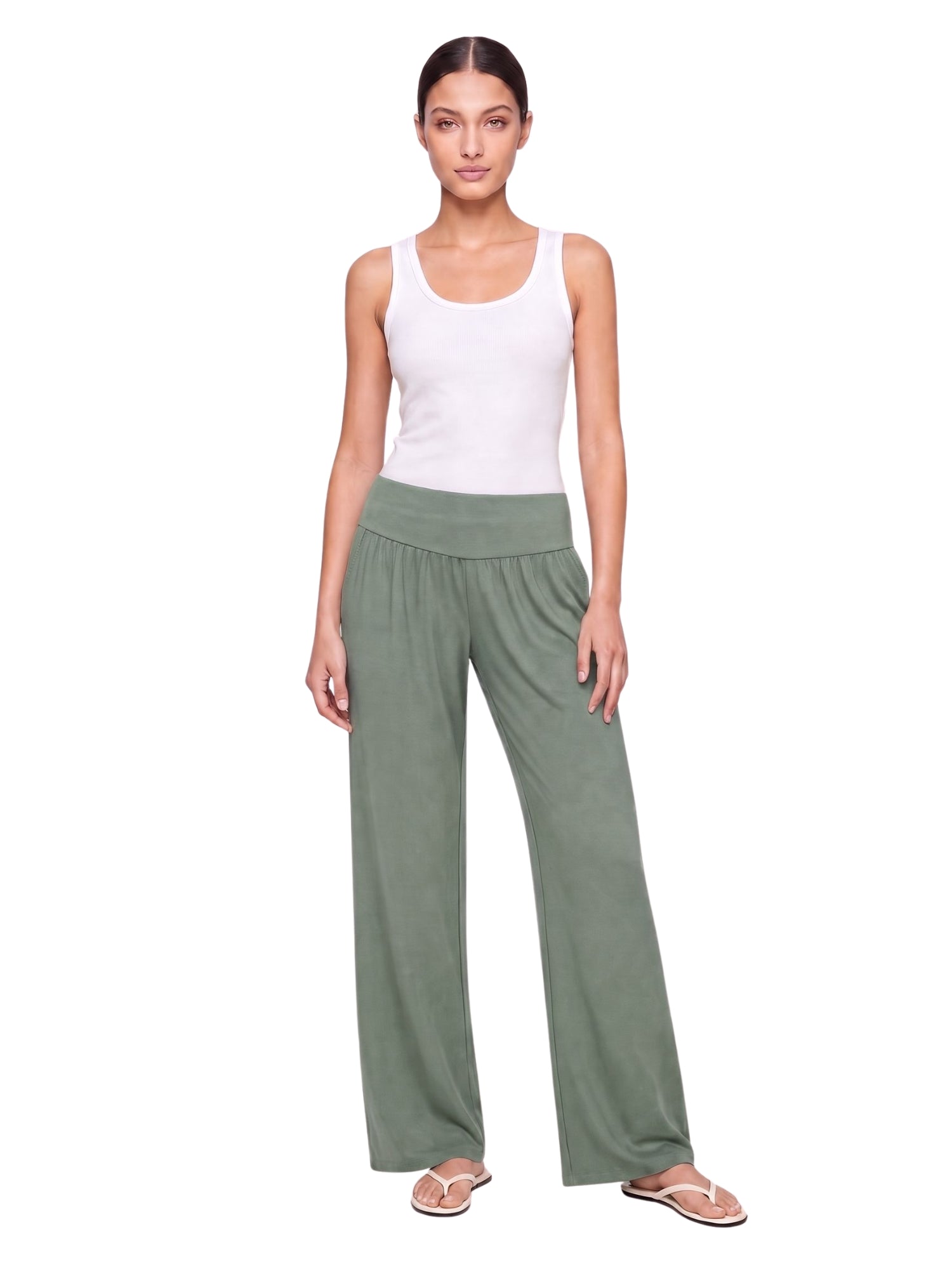 Olive green wide-leg lounge pants with elastic waist, paired with white tank top and flip flops for casual comfort.