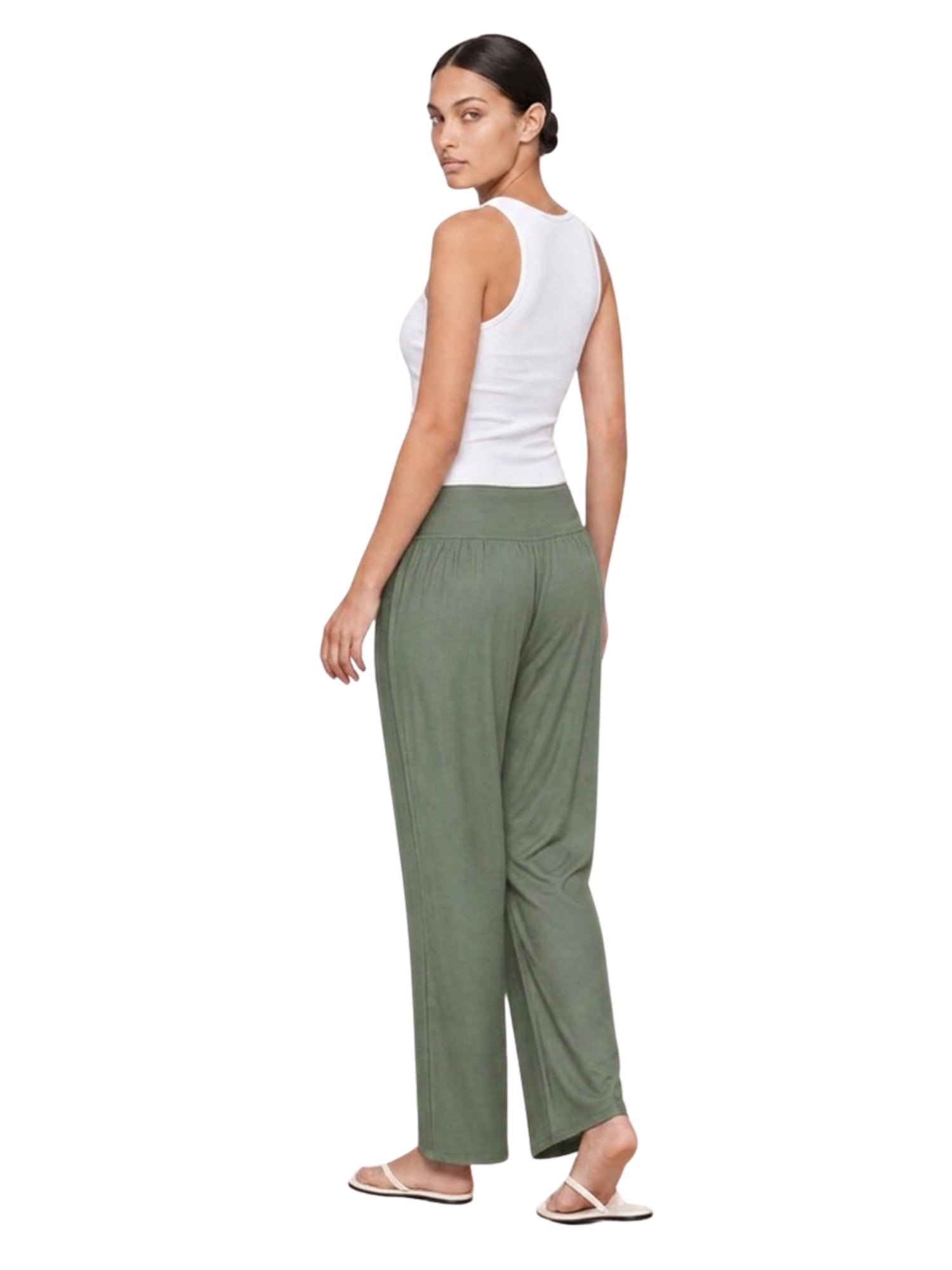 Woman in olive green wide-leg lounge pants, ideal for travel and home comfort.